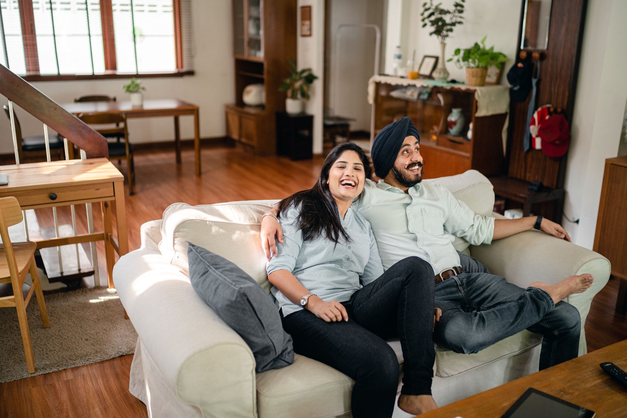 A couple sharing a quiet moment at home — the lives financial plans are meant to serve.